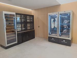 two display cases in a room with fish at DON LEONE Hotel in Alginet