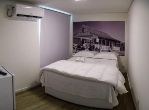 Postel nebo postele na pokoji v ubytování Suítes Container