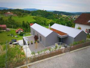 an aerial view of a house with a fence at Magdala Lodge - wellness oasis in Donja Pušća