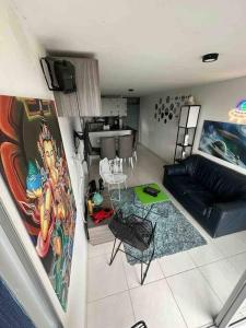 a living room with a couch and a table at Apartamento en Bucaramanga in Bucaramanga
