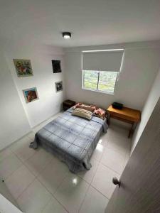 Una cama o camas en una habitación de Apartamento en Bucaramanga