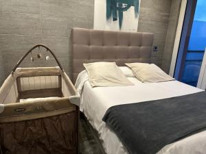 a bed with a large headboard in a room at Prime Loft ANDORRA HUT2-06207 in Pas de la Casa