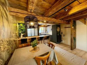 a kitchen and dining room with a table and chairs at L'Eden du Vignoble - Centre historique de Barr in Barr