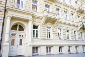 a large white building with a white door at Centrally Located Gem in Prague in Prague