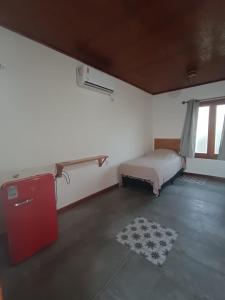 En eller flere senge i et værelse på Villa Chalés - térreo