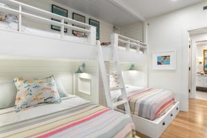 a bedroom with two bunk beds and a bed at K B M Resorts Montage Residence Pama 2206 Stunning Groundfloor 3 bed Perfect for Families Easy pool access LOccitane Amenities in Kapalua