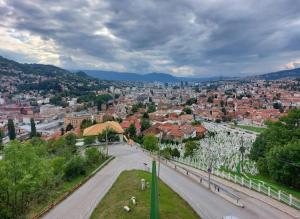 a view of a city with a road and buildings at Apartman Kovači in Sarajevo