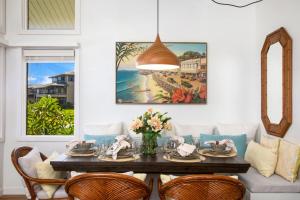 a dining room with a table and chairs at K B M Resorts- KRV-2823 Large 1Bd with 180-degree ocean views perfect for whale watching in Kaanapali
