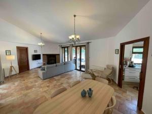 a living room with a table and a couch at Casa Estrella in Almería