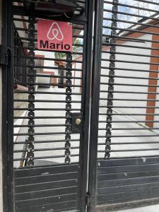 a front door of a marico store with a sign on it at MARIO in Alajuela City