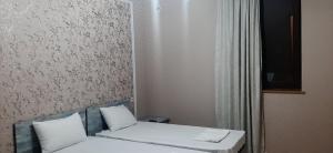 Postel nebo postele na pokoji v ubytování RUBENYAN GUEST HOUSE