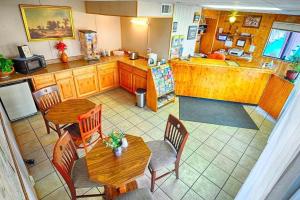 an overhead view of a kitchen with tables and chairs at San Miguel Inn in Socorro