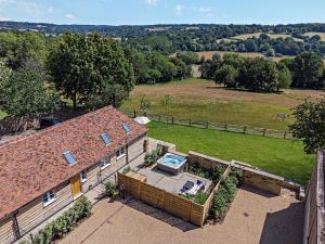 an aerial view of a house with a large yard at Dairy Barn by Bloom Stays in Groombridge