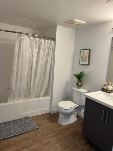 a bathroom with a toilet and a sink at Incredible Hollywood Loft Free Parking in Los Angeles