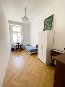 a living room with a refrigerator and a table at Center of Prague Apartment 369 in Prague