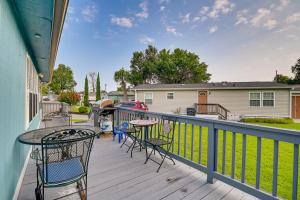 a deck with chairs and tables on a house at Surfside Beach Home with Community Perks Near Ocean! in Myrtle Beach