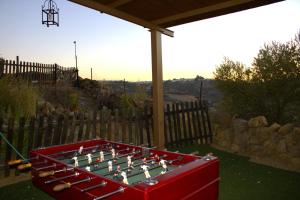 a large pool table with chessetts on it in a yard at CASA RURAL PRIVADA El MIRADOR DE LA SIERRA in Pruna
