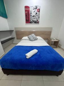 A bed or beds in a room at Hotel Boutique Deluxe