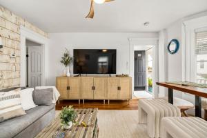 A seating area at A by the Bay - Stunning Seaside Apartment