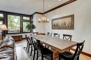 a dining room with a wooden table and chairs at Comfort at Arrowhead Village - Steps from the lift condo in Edwards