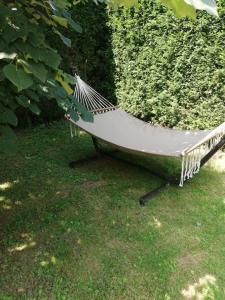 a hammock sitting on the grass in a yard at Villa ARDEN in Kartepe