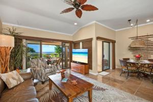a living room with a couch and a table at K B M Resorts- KGV-25P6 Breathtaking 2Bd remodeled villa, ocean and golf fairway views in Kapalua