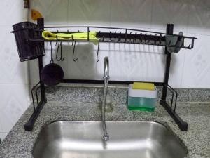 a kitchen counter with a sink and a strainer at Fresco Aparta estudio Envigado 101 in Envigado