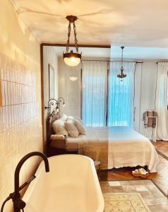 a bathroom with a bed and a bath tub at ANDRO LUX 2BR apartment with pool in Old Jaffa in Tel Aviv