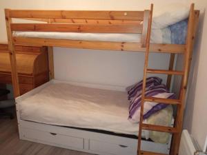 a couple of bunk beds in a room at appartement Netflix parking gratuit climatisation in Saint-Ambroix