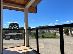 a view from the front door of a house at Pousada Serra Geral in Cambara do Sul