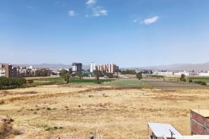 a view of a field with a city in the background at Depa de Estreno en Arequipa in Arequipa