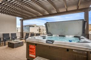 a hot tub sitting on top of a patio at The Pearl at Desert Shores townhouse in St. George