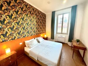 a bedroom with a bed and a large wall mural at Trevi Romantic Alcova in Rome