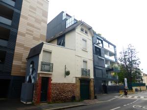 a building on the corner of a street at Le Coucou Rennais in Rennes