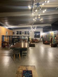 a large room with a wooden table and chairs at Los Andes Bed & Breakfast in Arequipa