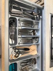 a drawer filled with utensils in a refrigerator at High Barnes 3 Bed House with Parking, Sleeps 7, Quiet Location in Sunderland