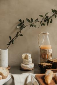 a table with bread and a bottle of orange juice at Octavia Casa in Mexico City