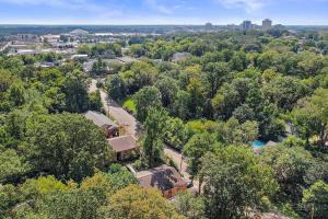 an aerial view of a neighborhood with trees and a city at Your home away from home! in Jackson