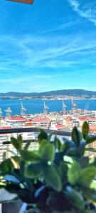 a view of a city with a view of the water at VistasAragon in Vigo