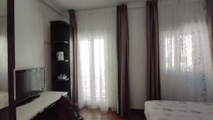 Ein Bett oder Betten in einem Zimmer der Unterkunft Dormir en Cádiz