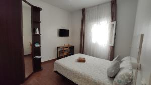 Ein Bett oder Betten in einem Zimmer der Unterkunft Dormir en Cádiz