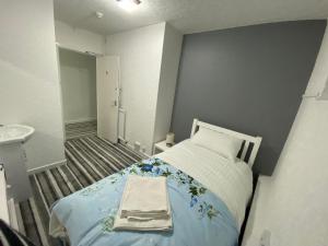 Postel nebo postele na pokoji v ubytování Aaran Central Guesthouse