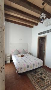 Ein Bett oder Betten in einem Zimmer der Unterkunft Dormir en Cádiz