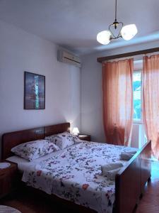 a bedroom with a bed and a window at Double Room Jelsa 4602a in Jelsa