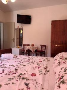a bedroom with a bed and a table with chairs at Double Room Jelsa 4602a in Jelsa