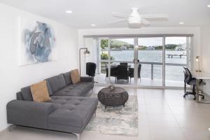 a living room with a couch and a table at 232C South Finger in Jolly Harbour