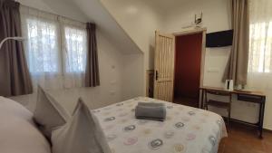 Ein Bett oder Betten in einem Zimmer der Unterkunft Dormir en Cádiz