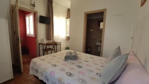 Ein Bett oder Betten in einem Zimmer der Unterkunft Dormir en Cádiz