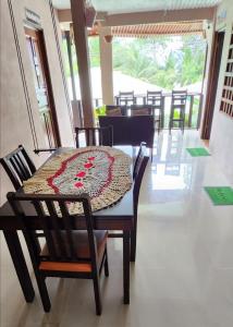 a dining room table with a table cloth on it at Apartahotel & Gym Rondon in Tortuguero