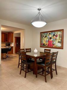a dining room with a table and chairs at Spacious 4bd25ba Retreat Near Hospital & Tumon in Tamuning